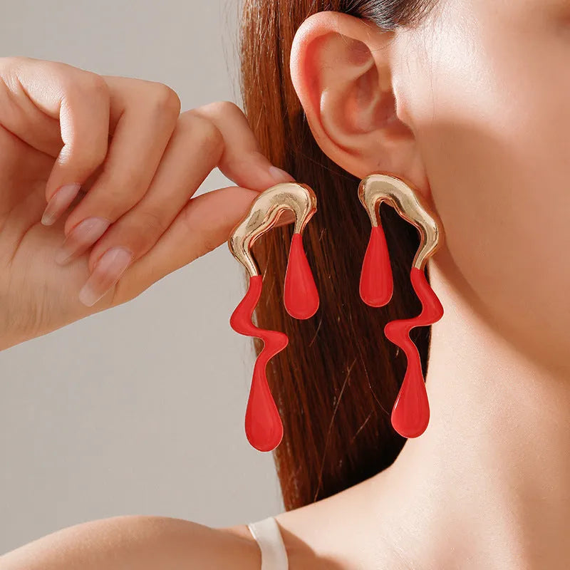 Liquid irregular geometric ear studs in gold, made from zinc alloy with electroplated finish, unique water drop design for women