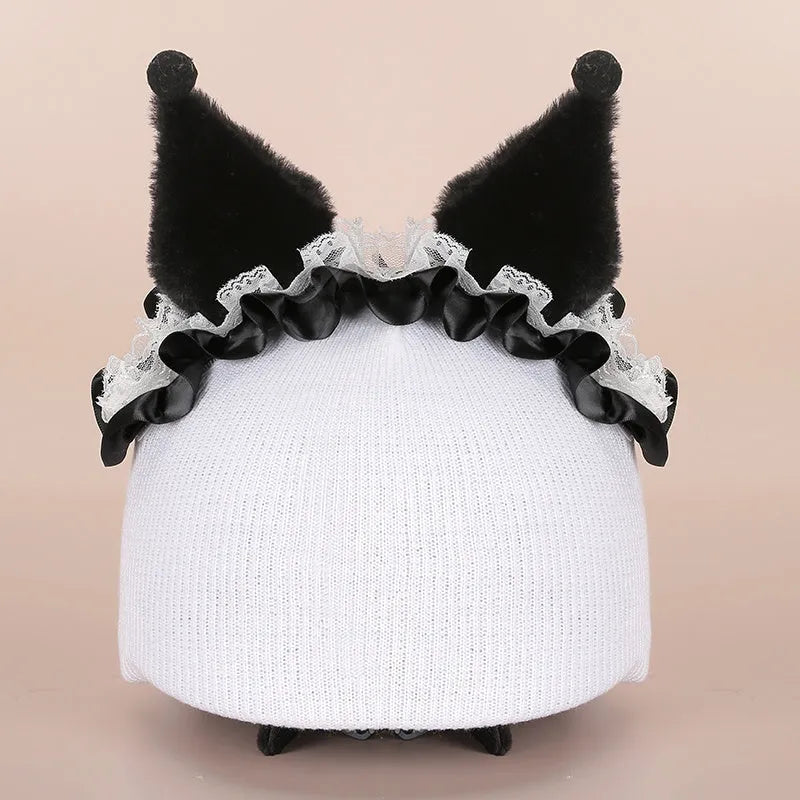 Colourful plush cartoon hat decoration sitting on top of a ski helmet