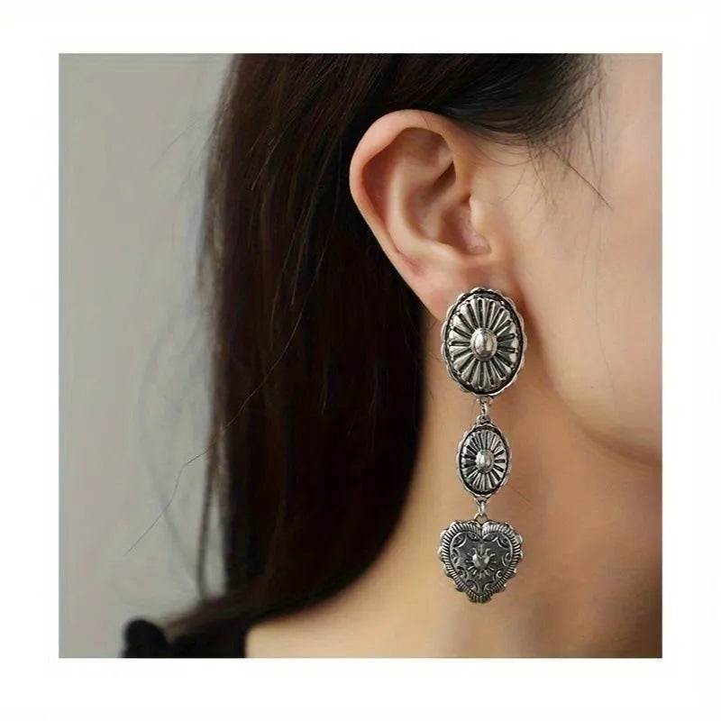 Pair of silver-toned vintage tassel water droplet shaped long chain drop earrings with hook fastening