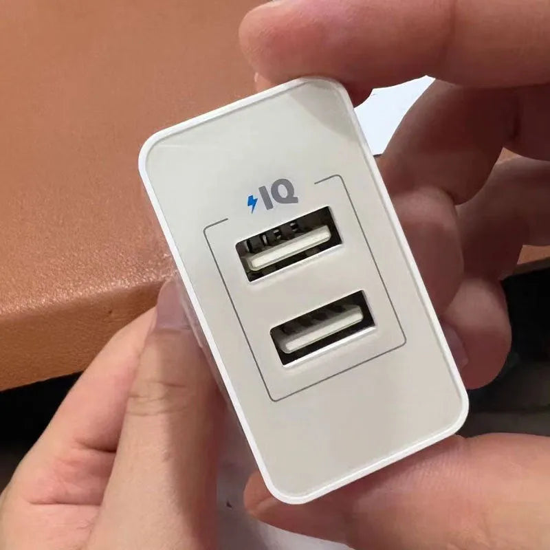 White dual-port USB charger with UK plug, 12W output, 2.4A per port, PD protocol support