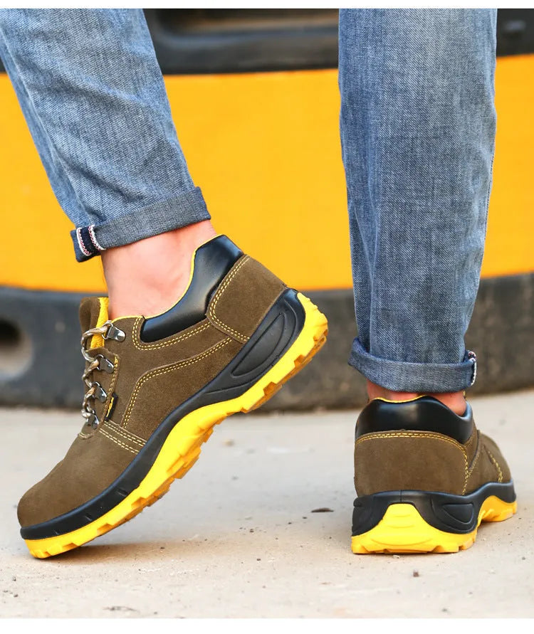 Bronze coloured low-cut leather safety boots with a steel toe cap and textured anti-skid sole.