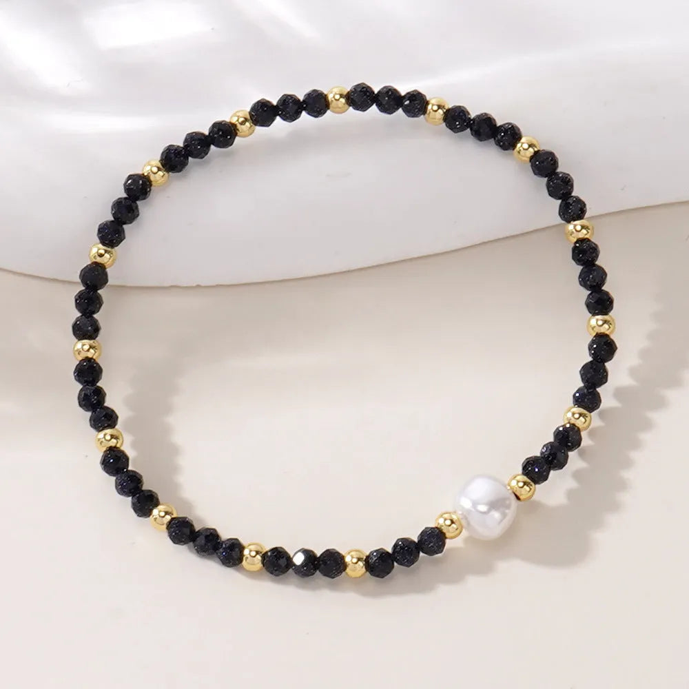 Natural stone geometric ellipse bracelet showing structured design and material texture