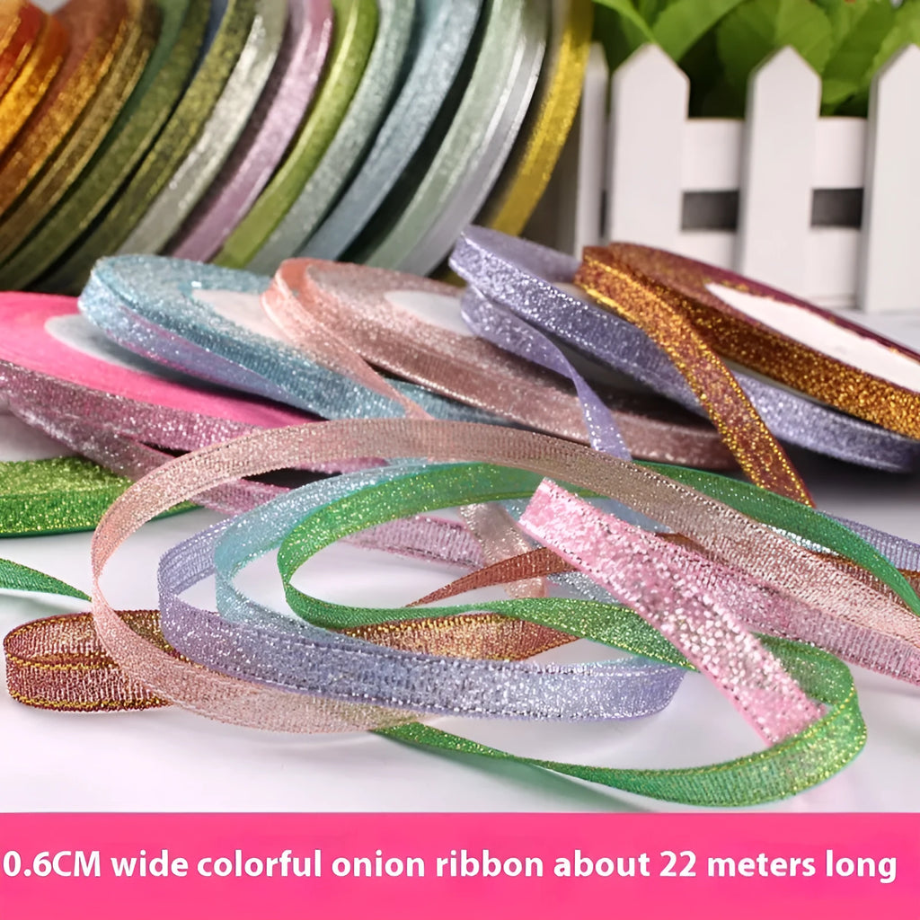 Roll of thin 0.6cm wide polyester ribbon in a selection of 22 colours including metallic gold and sky blue.