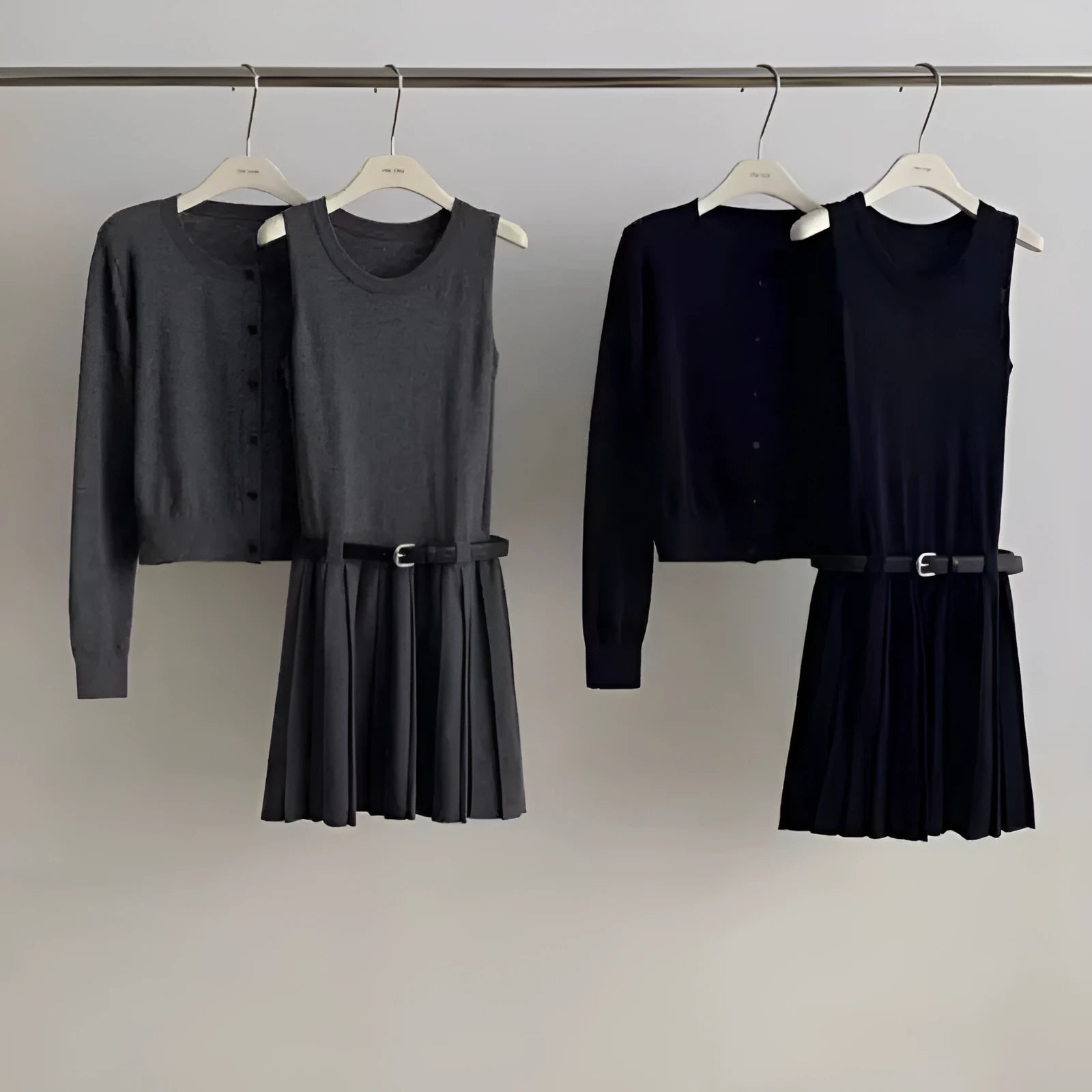 Grey art retro knitted two-piece set with 3D pattern, featuring a pleated vest skirt and long-sleeved cardigan with an adjustable belt.