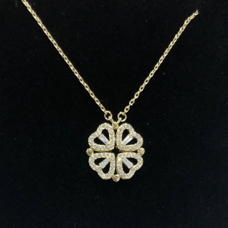 Heart shape four leaf clover pendant necklace in cupronickel 18K gold finish on white background