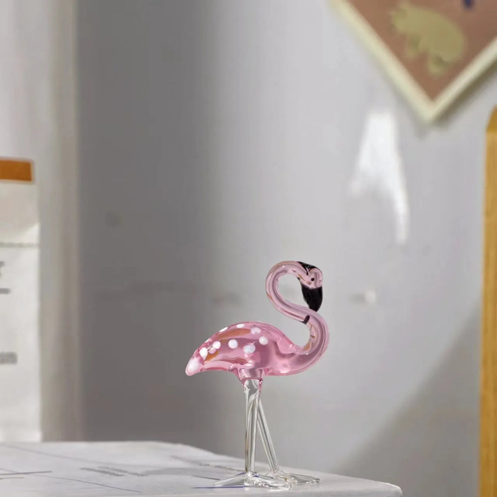 Pink flamingo crystal decorative figurine on a white base for modern home table decor.