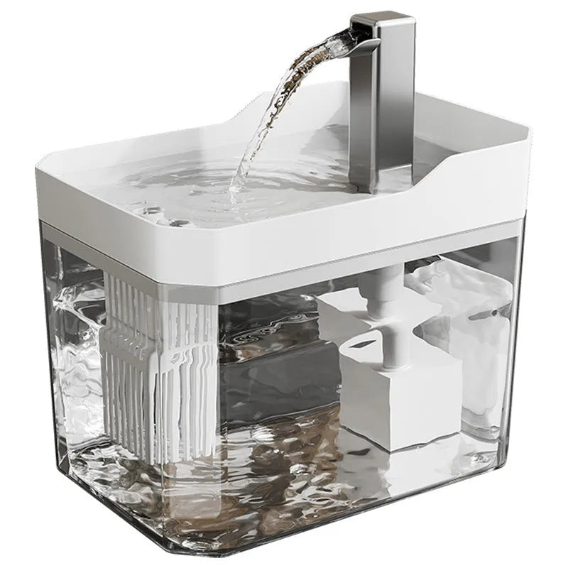 Automatic cat water fountain with filter in transparent plastic, showing water flow.