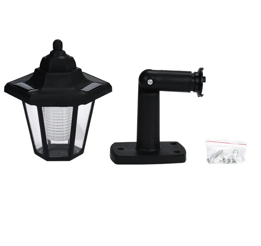 Black hexagonal solar-powered wall light with integrated solar panel and waterproof IP44 rating for outdoor use