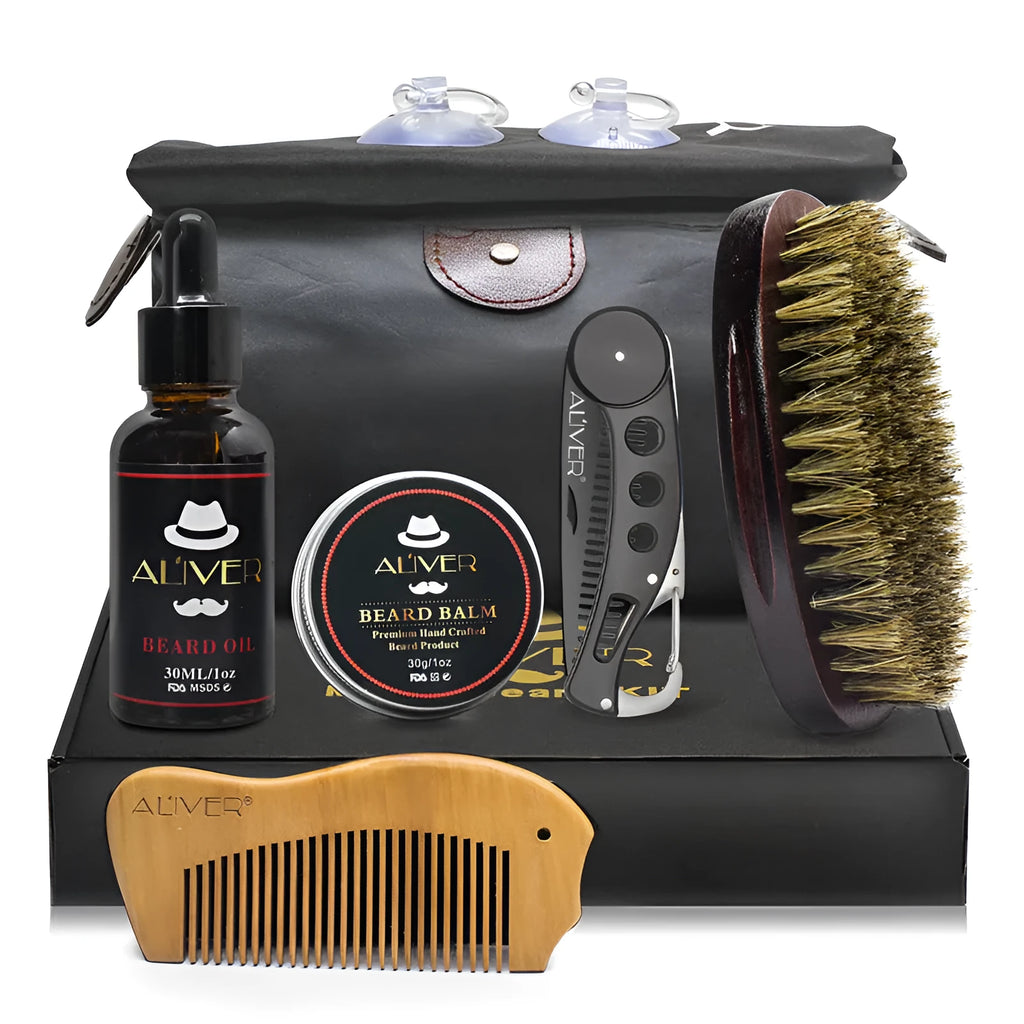 7-piece black beard grooming set with wood brush, metal comb, scissors, apron and cleaning brush on a surface