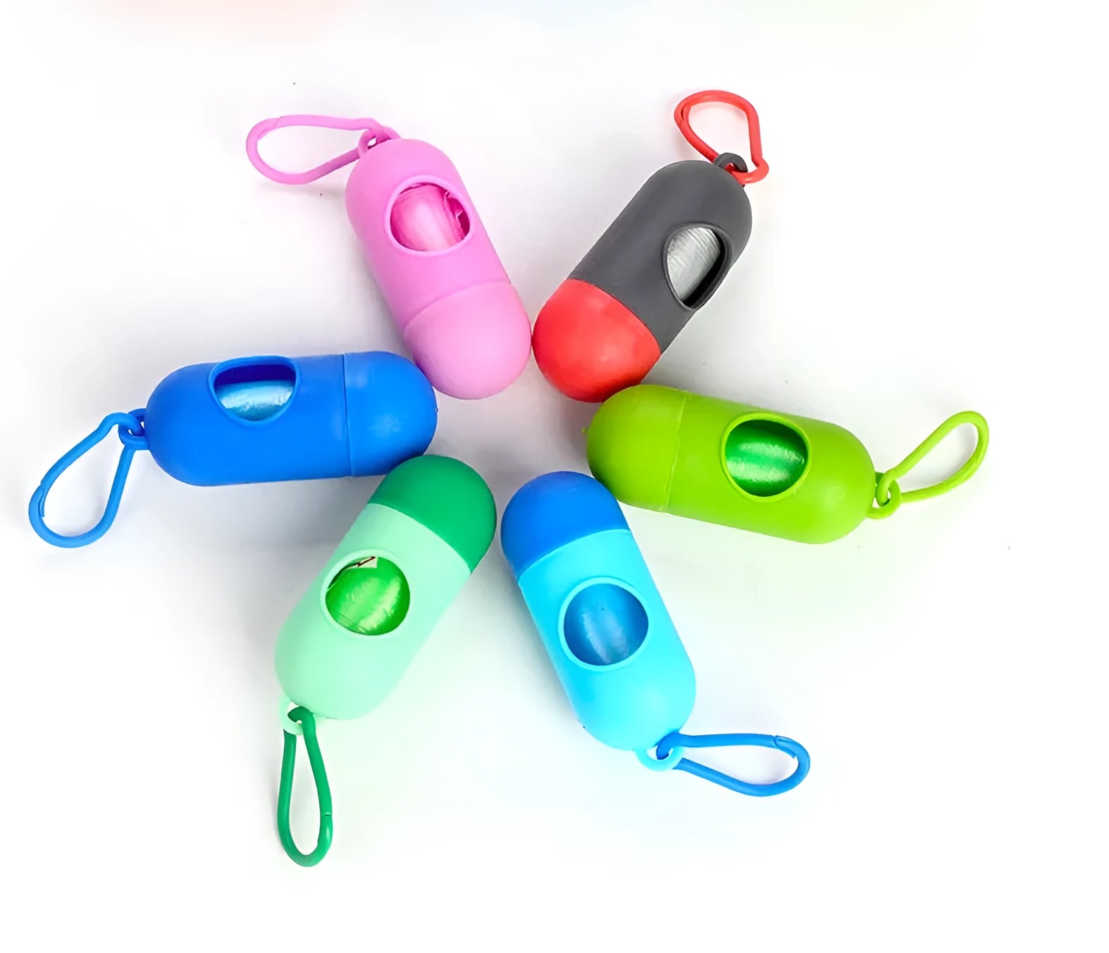 Roll of 22.5x30cm dog waste bags in assorted colours on a green background.