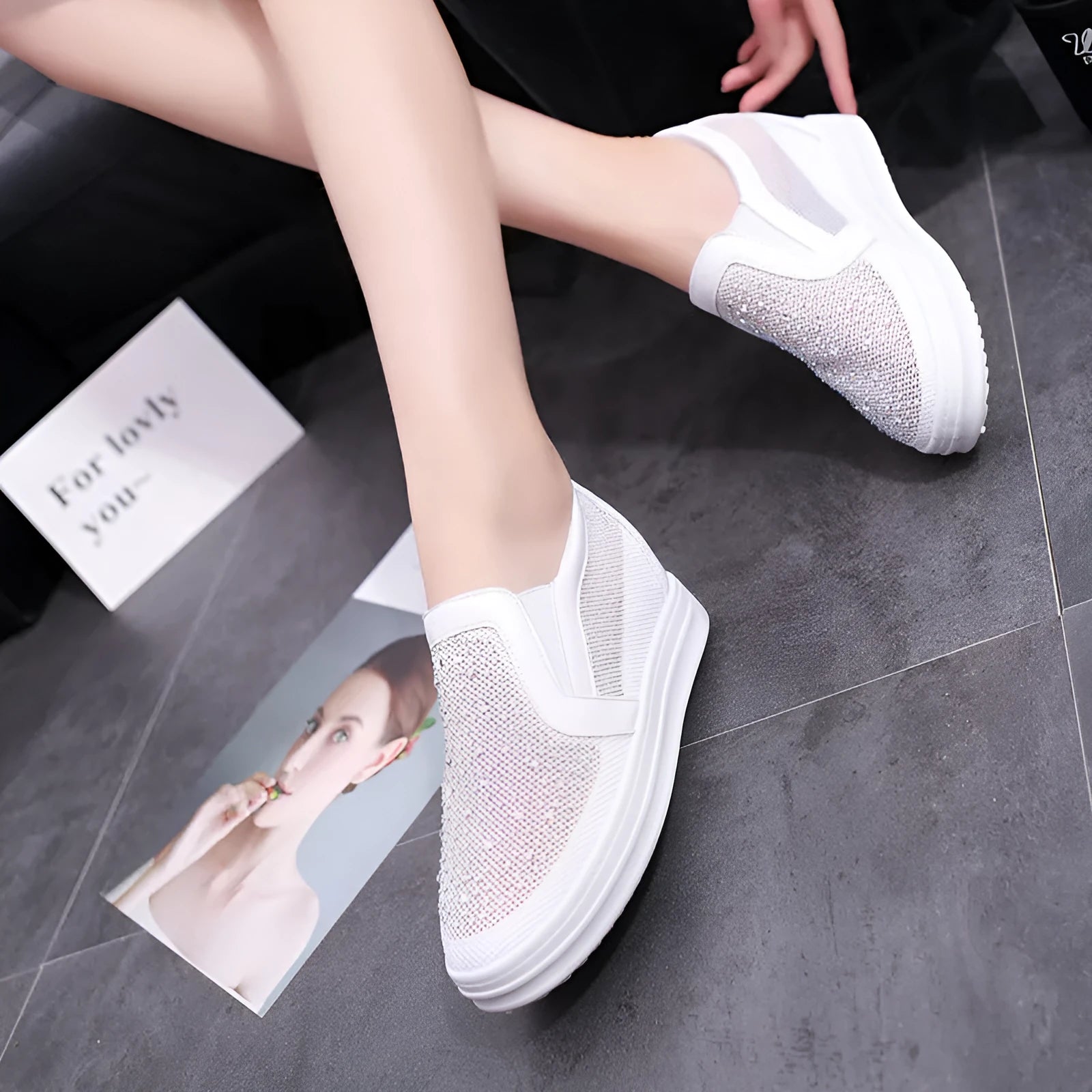 Women's wedge slip-on shoes in black with mesh upper and round toe