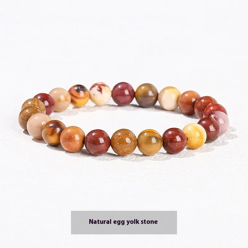Natural tigereye crystal bracelet with yellow tiger eye beads approximately 8mm diameter on elastic cord