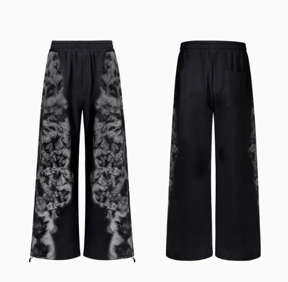 Women's grey loose-fit co-ord set with collage-stitch hoodie, matching trousers, and seven-inch shorts on a hanger.
