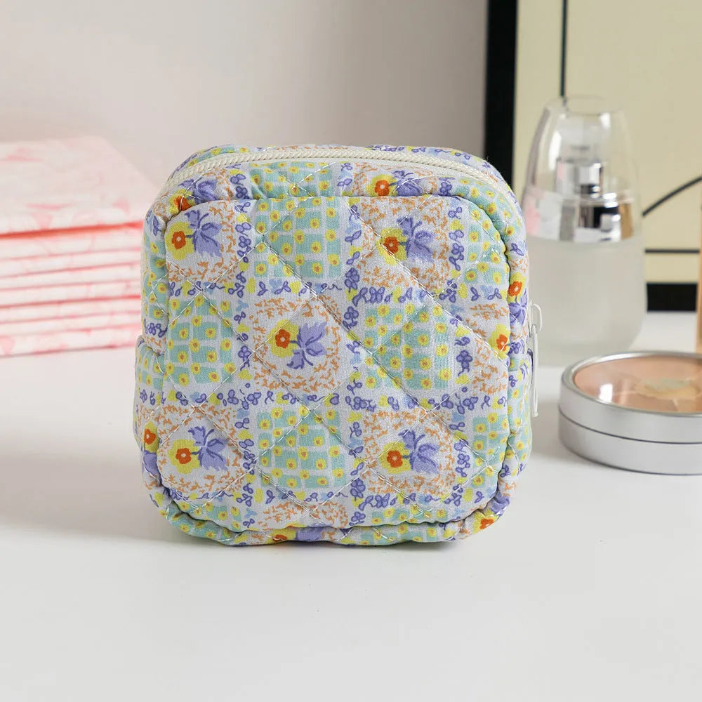 Floral pattern key storage bag made from breathable polyester fabric in various colour options.
