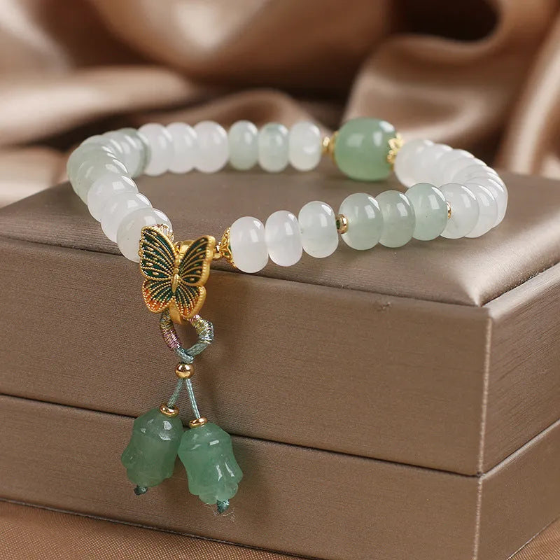 Green jade bracelet with abacus beads and electroplated butterfly tassel decoration