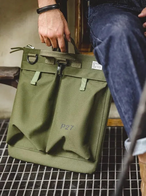 Retro military green canvas messenger bag with crossbody strap and zipper closure
