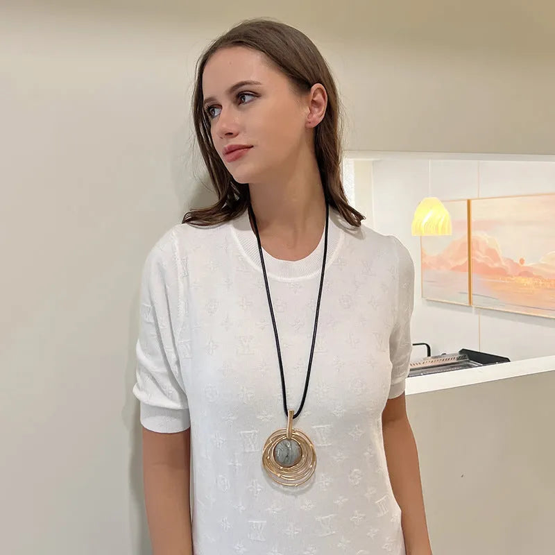 Women's vintage gold adjustable long necklace with geometric plaid alloy pendant on a snakeskin wax rope chain.