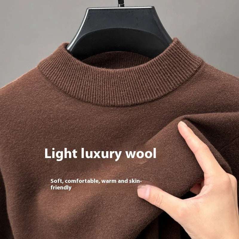 Men's fine wool half turtleneck sweater in a solid colour, showing long sleeves and regular fit.