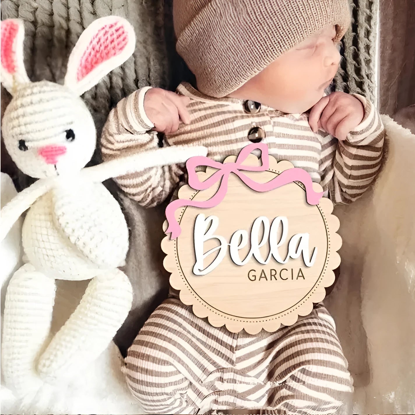Square wooden baby room ornament with a customised name, shown in two size options.