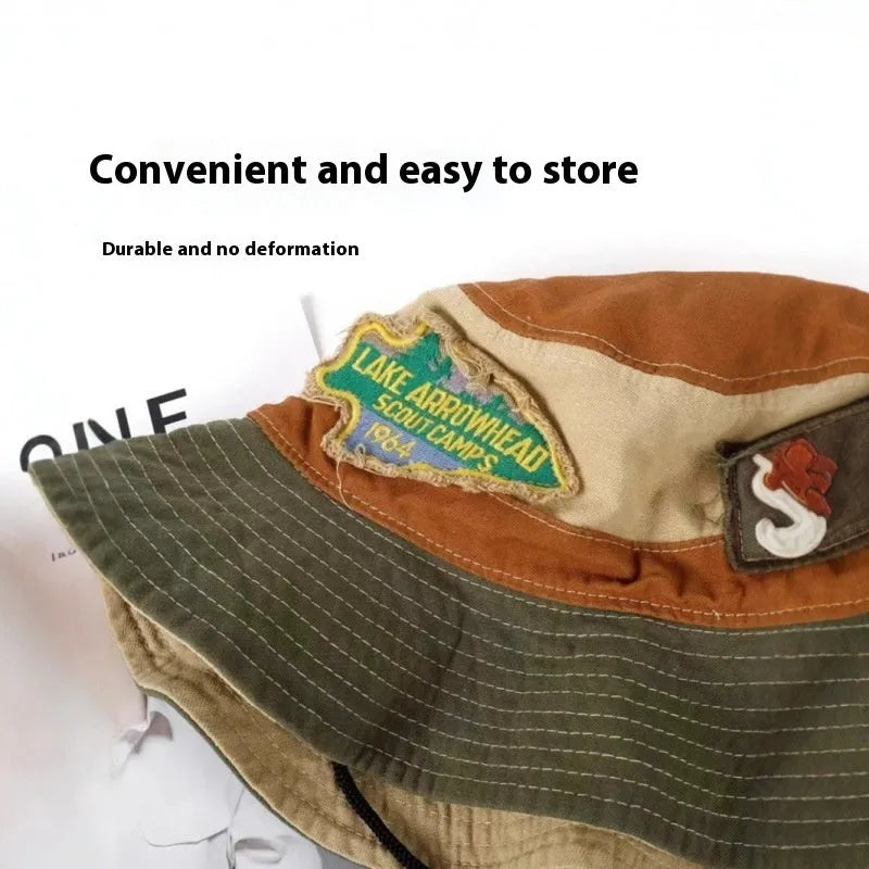 Army green cotton fisherman hat with a patchwork design and a flat-top crown.