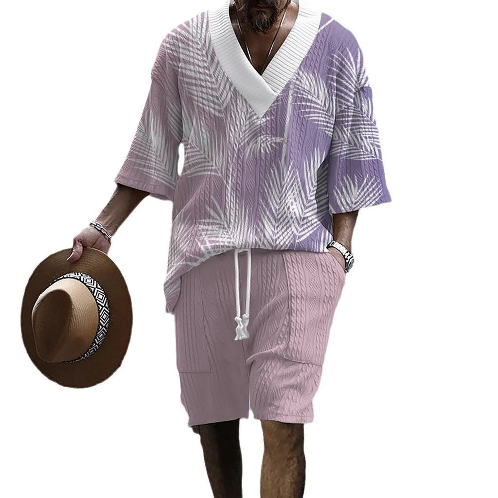 Man wearing a printed drop-shoulder short-sleeved knitted top with matching shorts.
