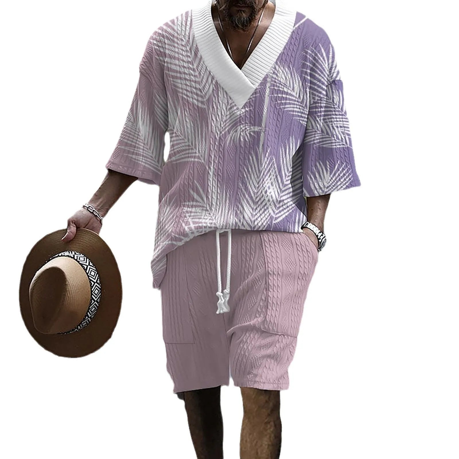 Man wearing a printed drop-shoulder short-sleeved knitted top with matching shorts.