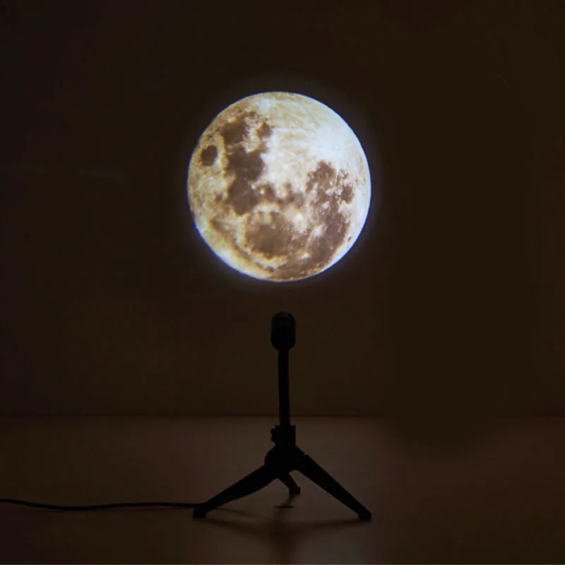 Earth and Moon star projection lamp with flexible hose bracket on a table