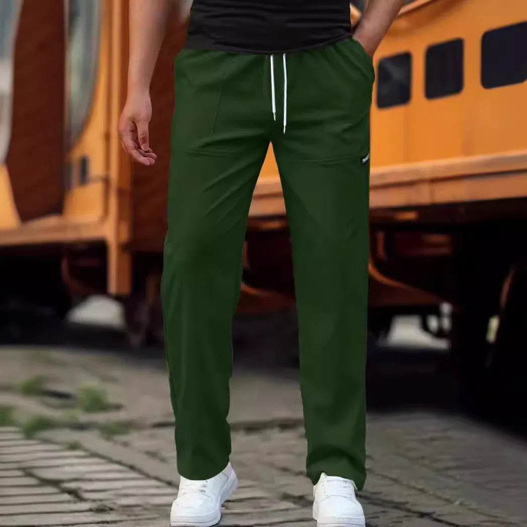 Men's light grey polyester casual trousers for spring and autumn wear.