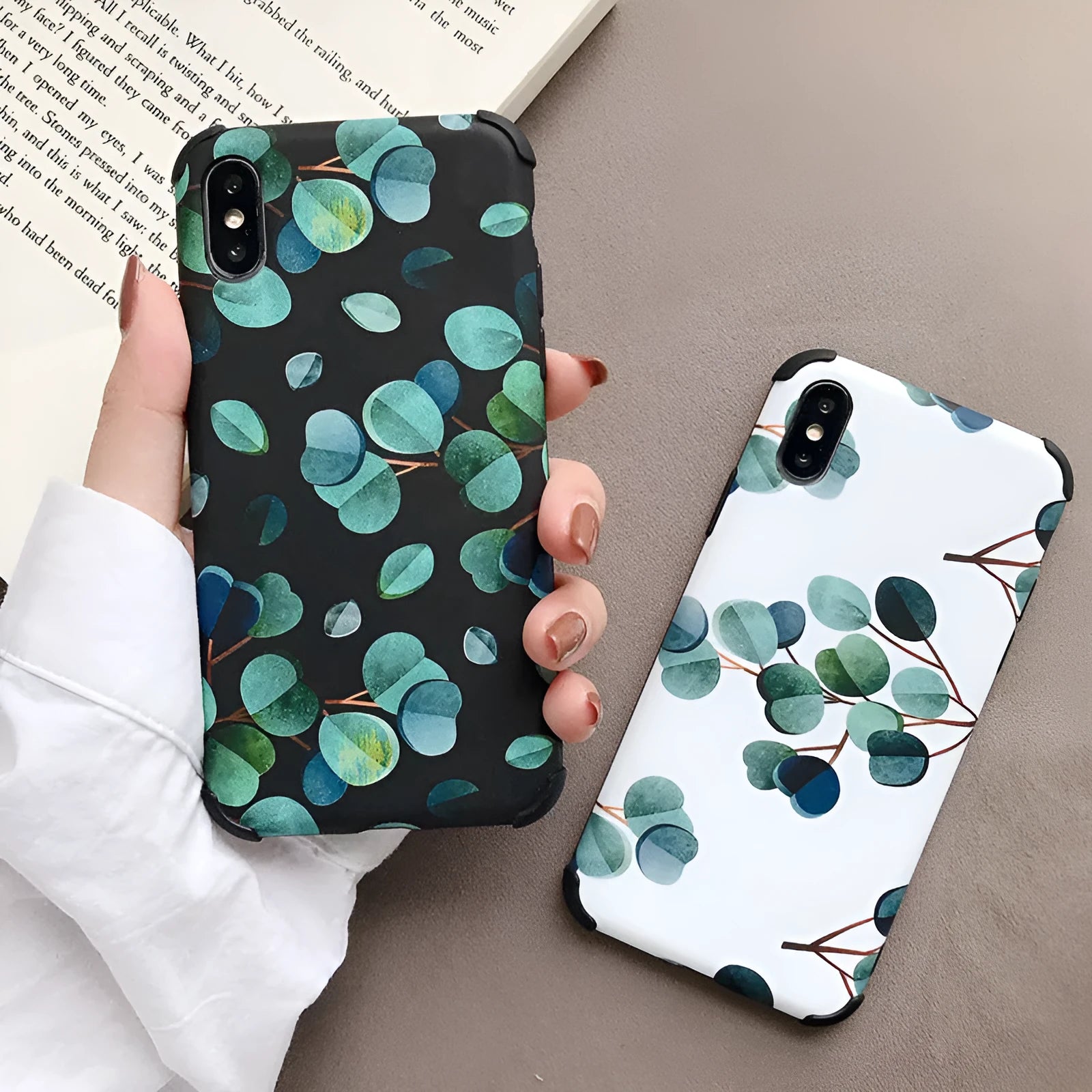 Black silicone iPhone case featuring a raised leaf pattern design on the back.