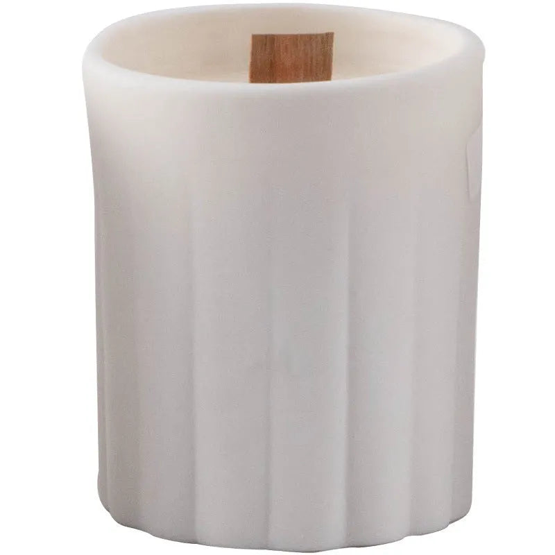 Minimalist ceramic round candlestick with relief pattern on a dining table