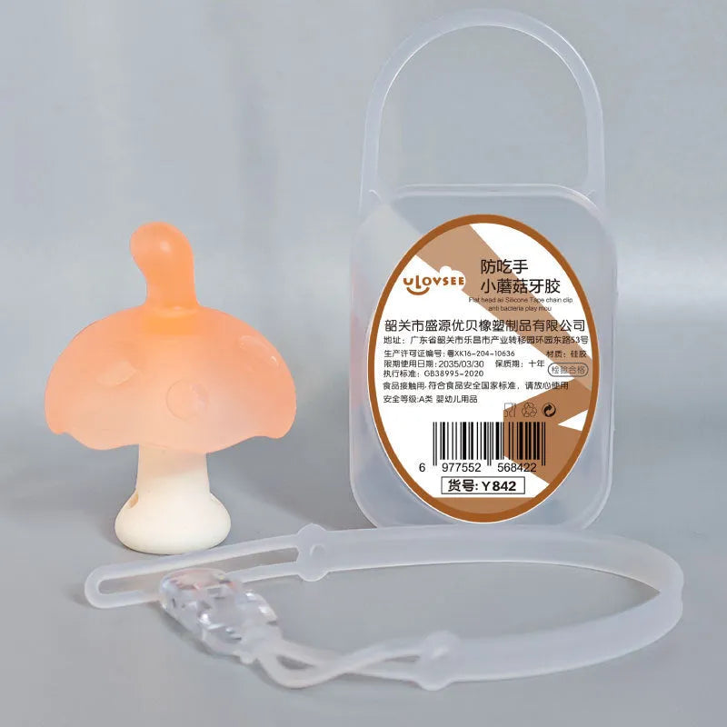 Small pink mushroom-shaped latex chewing gum in a transparent box with a chain.