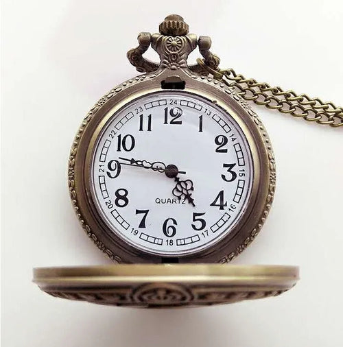 Bronze United States Coast Guard 1790 pocket watch with chain on light background