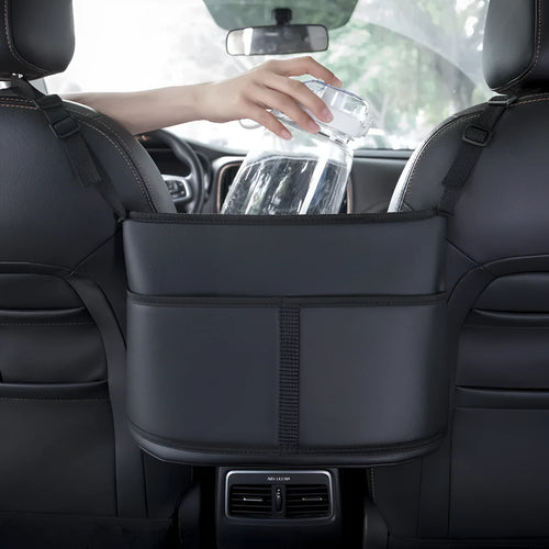 Black leather car seat storage bag with carbon fibre pattern measuring 38x24x15cm