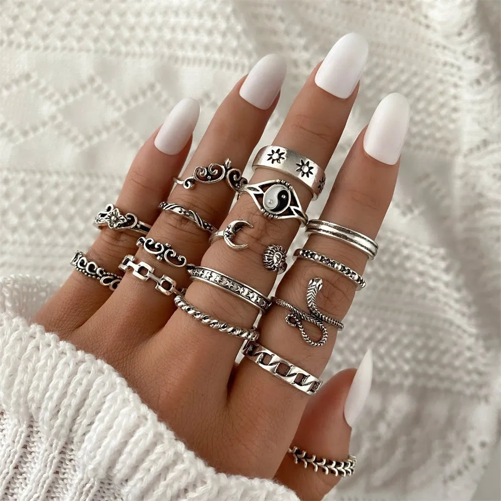 Alloy ring set with butterfly and snake retro geometric designs on display