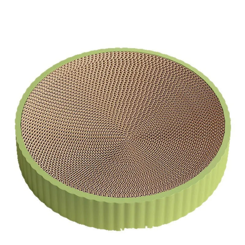 Round green cat scratching board with replaceable corrugated centre measuring 55 cm diameter