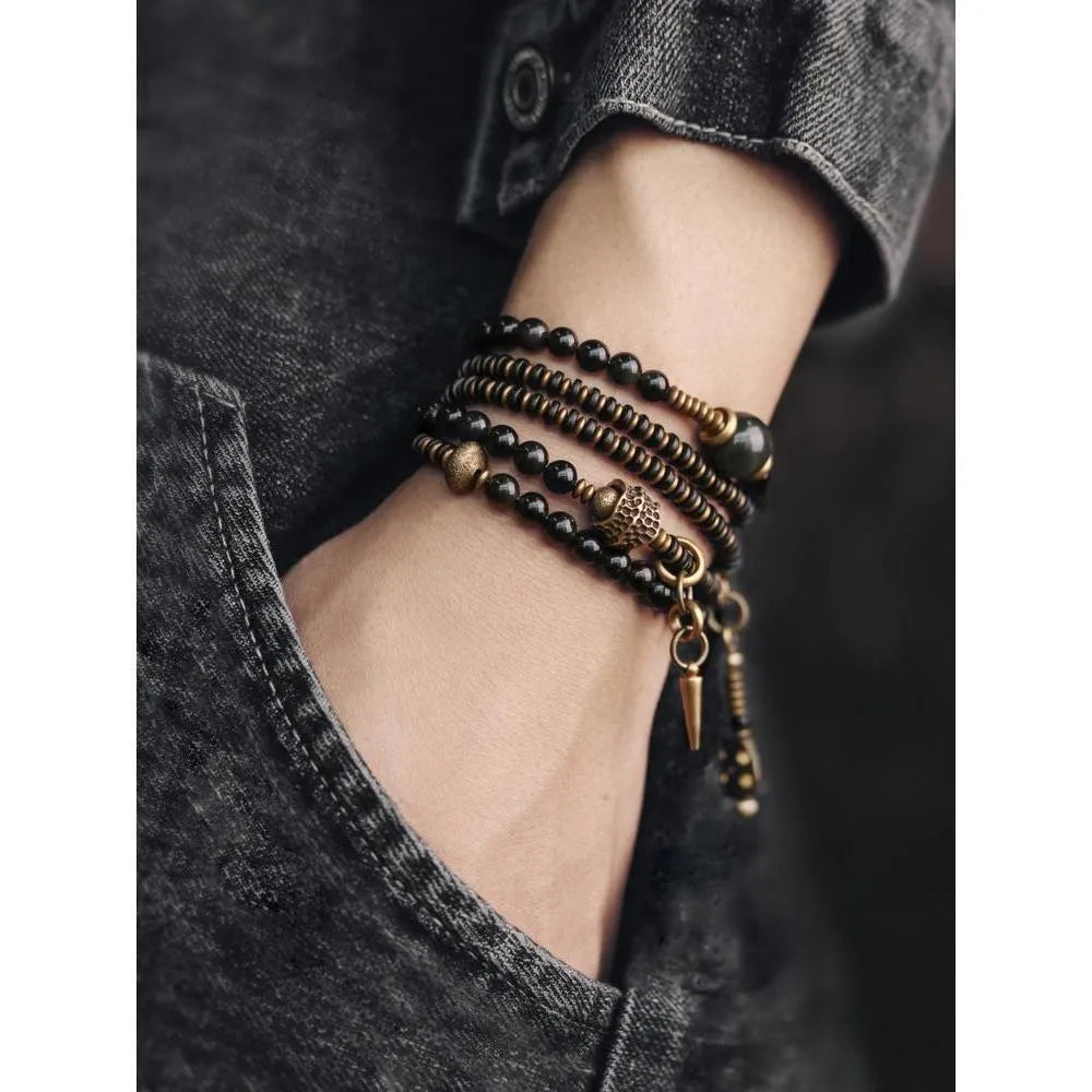 Black retro colourful geometric beaded bracelet with a multi-layered design.