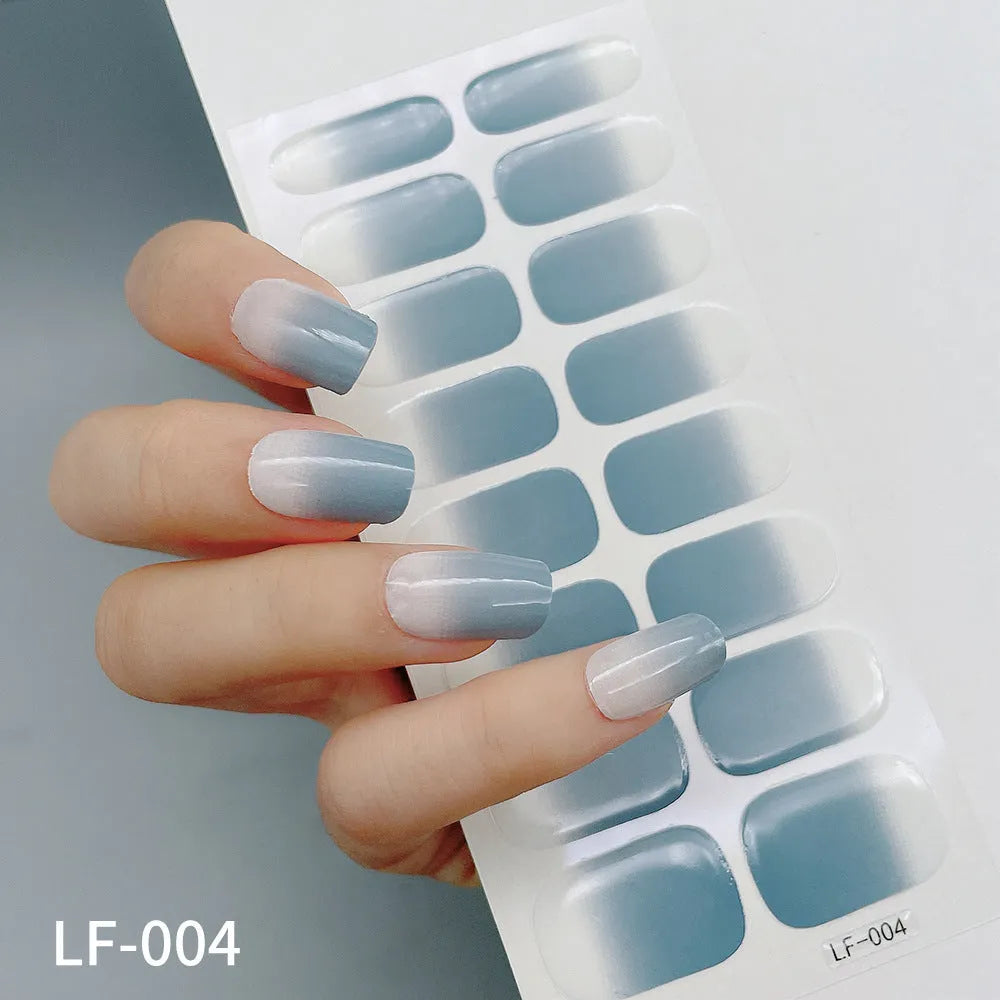 16 solid colour full nail art stickers with 22 patterns including cross, rose, butterfly designs in 12x6mm oval size