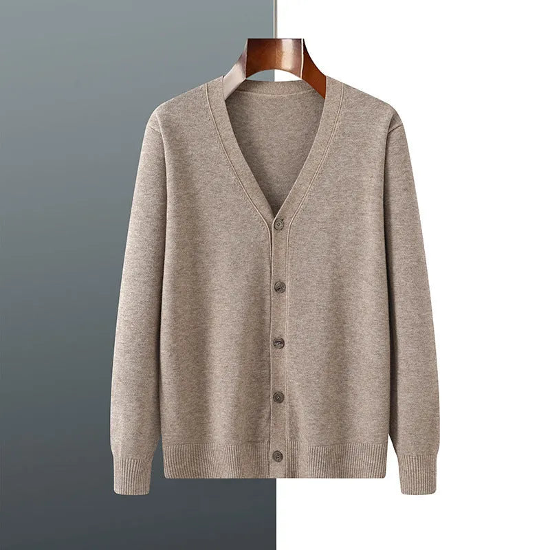 Man wearing a beige Andy velvet V-neck knitted cardigan coat with long sleeves.