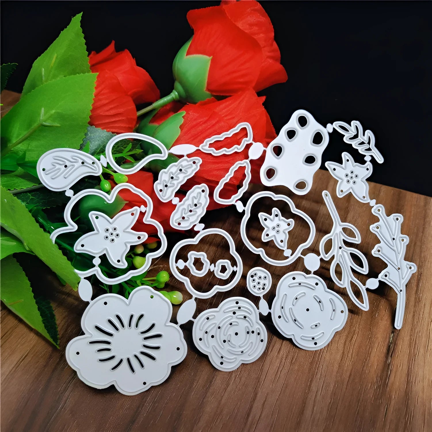 Silver carbon steel flower cutting die with plant etching pattern measuring 14.3 by 9.9 cm