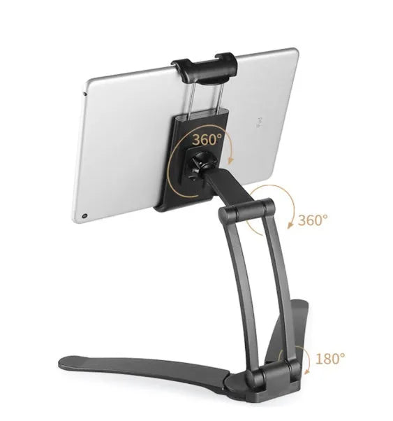 Silver aluminium alloy desktop stand holding a tablet, showing 360-degree rotation and adjustable clamp mechanism.