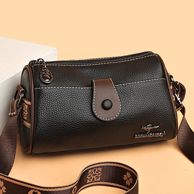 Women's top grain leather crossbody bag in blue, black, or khaki with horizontal square shape and inner pockets.