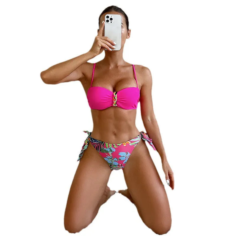 Rose red women's bikini swimsuit with a braided rope design detail on a mannequin.
