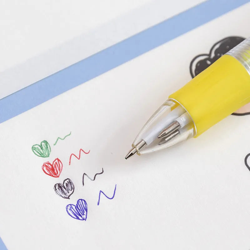 Four-colour press ballpoint pen with random cartoon design and silicone grip.