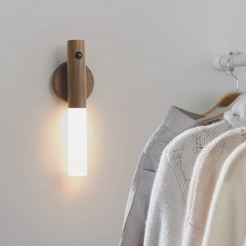 Wooden smart sensor LED desk lamp on a desk, showing compact size and simple design.