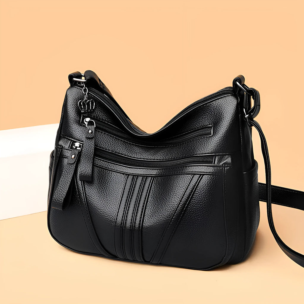 Genuine leather cross-body messenger bag in horizontal square shape with internal organisers