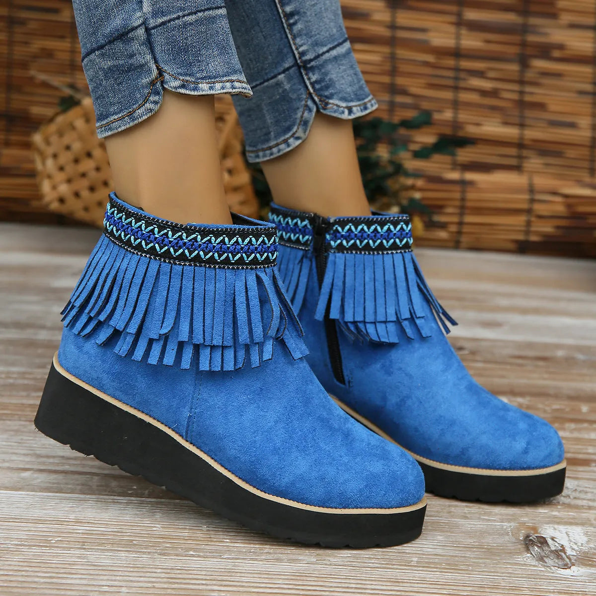 Women's black suede wedge ankle boots with side zipper and tassel detail