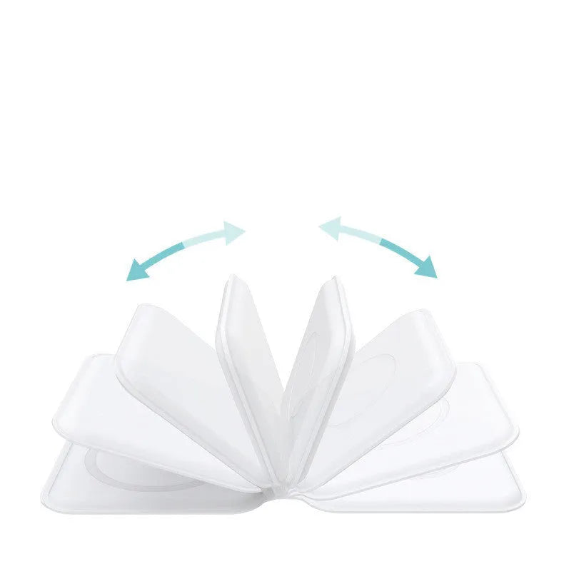 White foldable magnetic wireless charger dock with phone attached, showing angled stand mode.