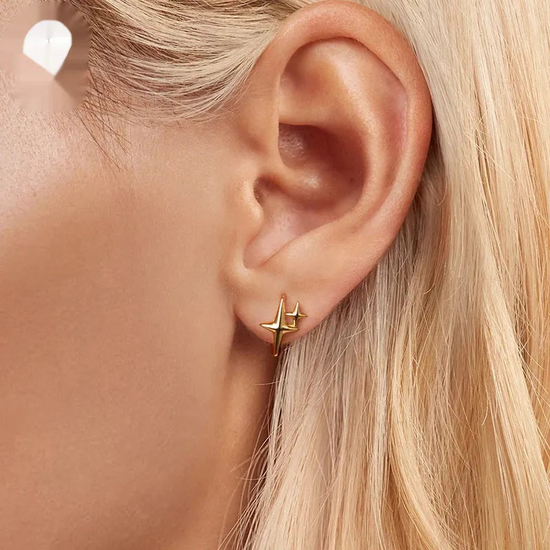 Minimalist star motif ear clips in oxidised sterling silver jewellery with clip design