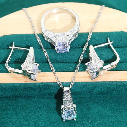 Bridal zircon jewellery four-piece set showing necklace, bracelet, earrings, and ring with water wave chain styling