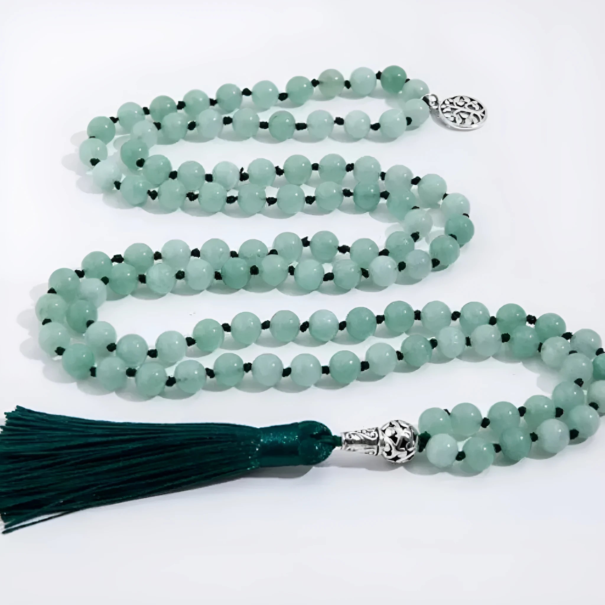 Long handmade necklace with 108 small round stone beads on a black cord, shown doubled up.